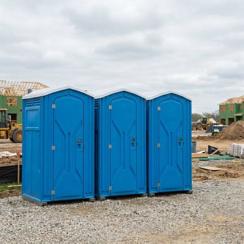 Standard porta potty rental units at a Fresno, California construction site